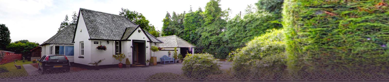 Driveway and front entrance of Glenview Luss, Cottage B&B Accommodation with Leylandii trees in the background