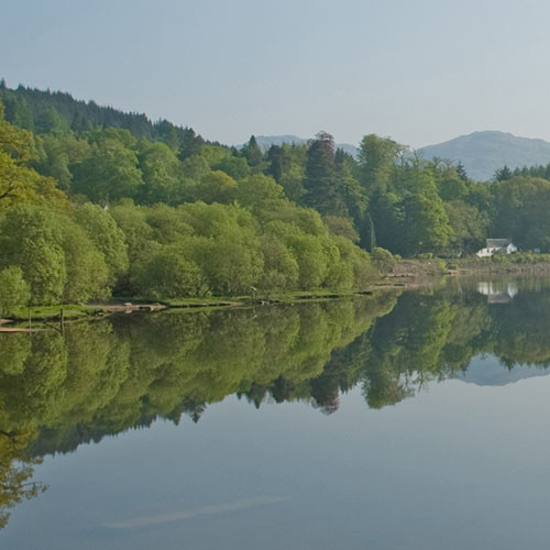 Loch Lomond with white cottage